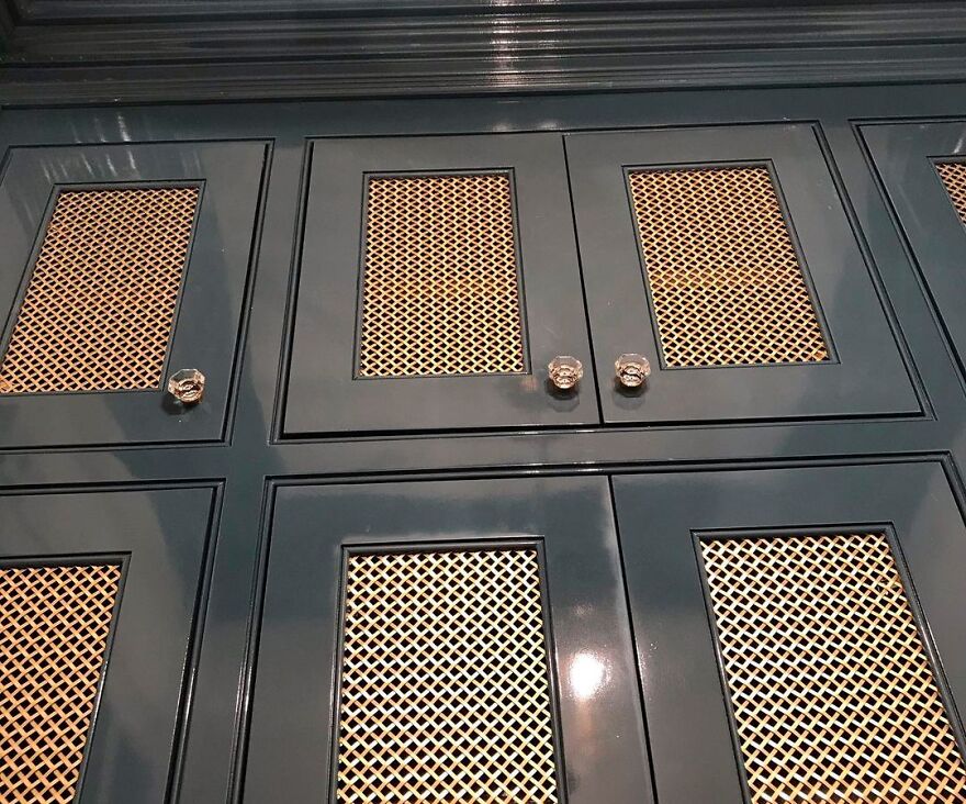 Brass mesh stylish kitchen cabinets with dark framing, showcasing modern design and texture for kitchen renovation inspi