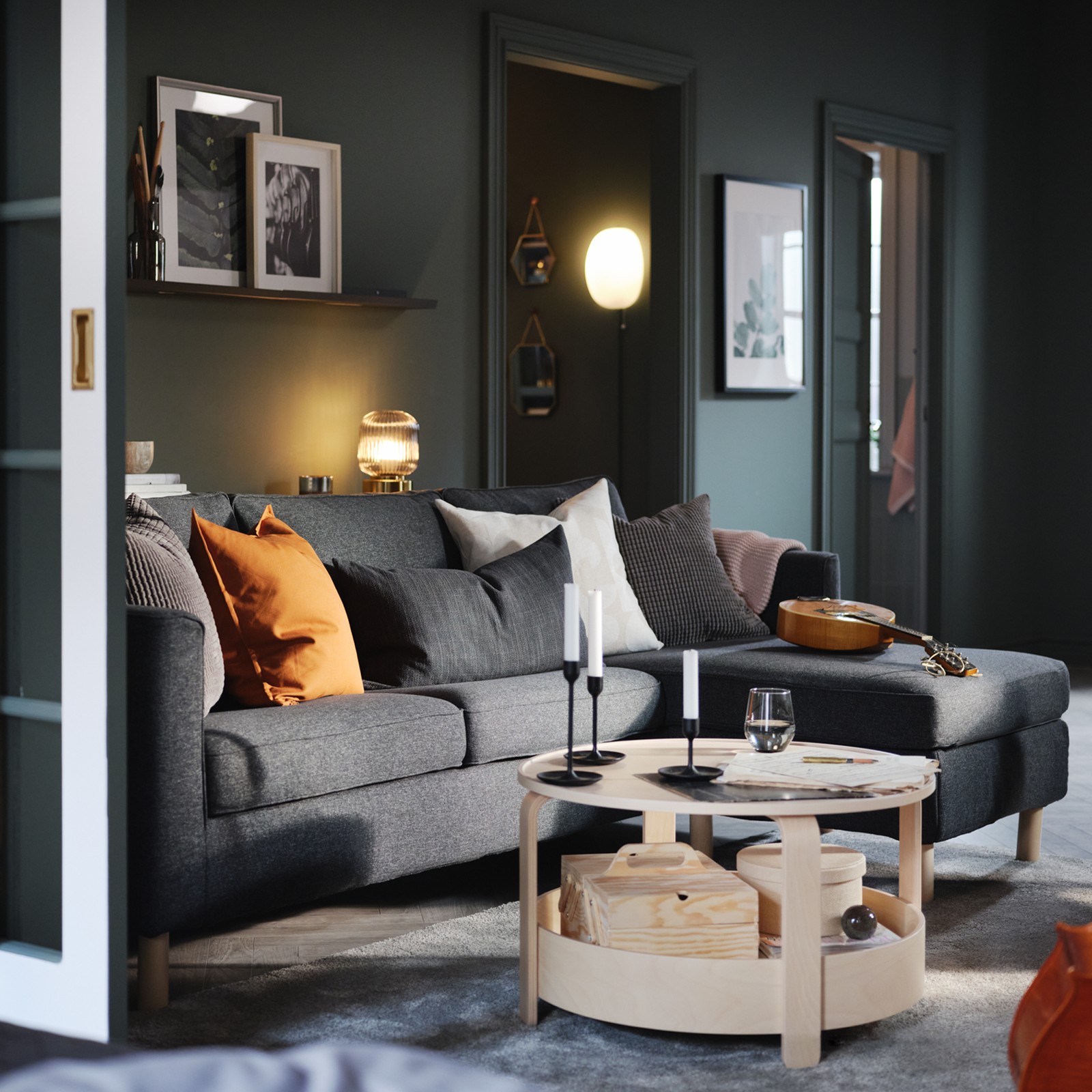 A living room with a chaise longue sofa and a coffee table.