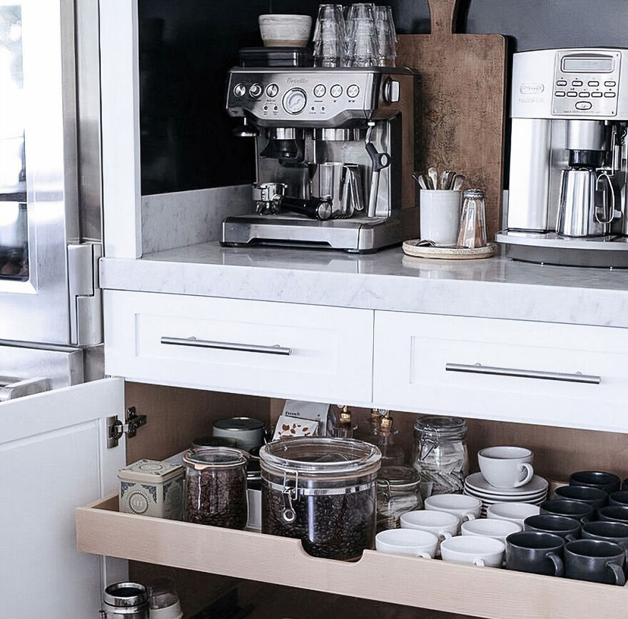 Modern kitchen cabinets with a metal coffee machine and organized coffee appliances for a stylish renovation inspiration
