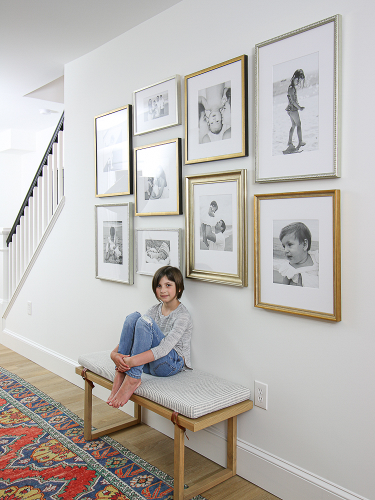 white wall with mixed frame gallery, family photo gallery