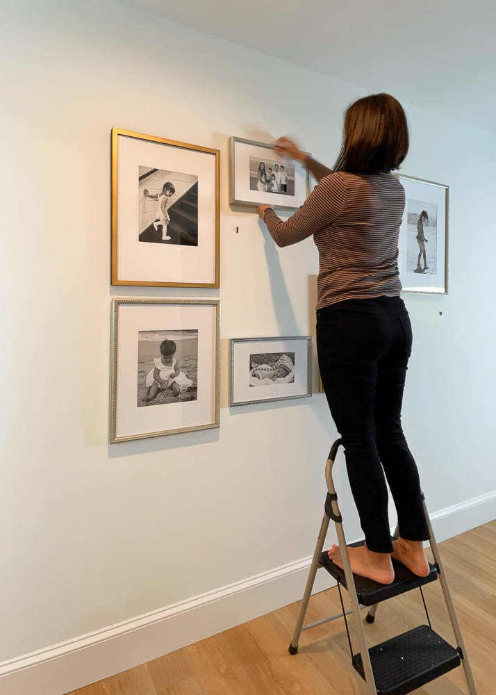 Stefana Silber hanging her Framebridge wall gallery