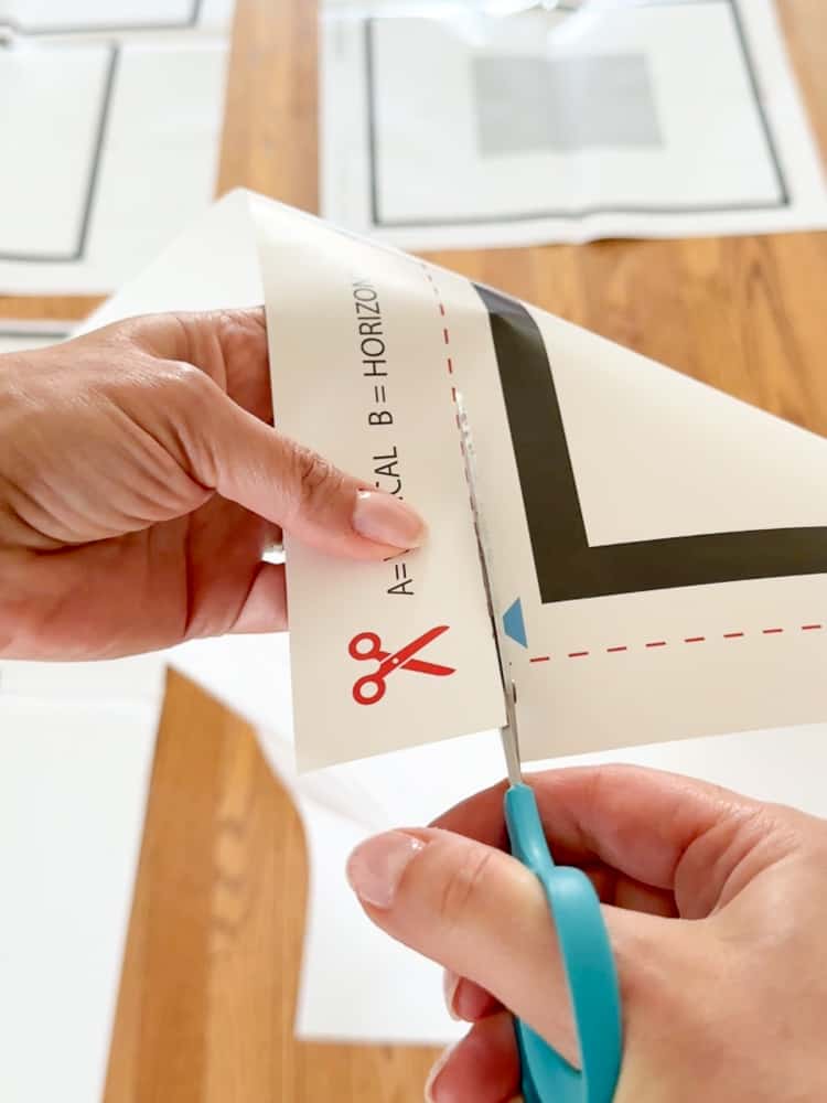 person cutting template for photo gallery